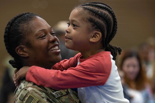 Female Soldier with Child